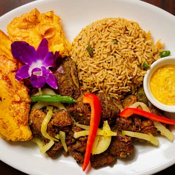 A vibrant dish with rice, meat, plantains, and a purple orchid garnish on a white plate.